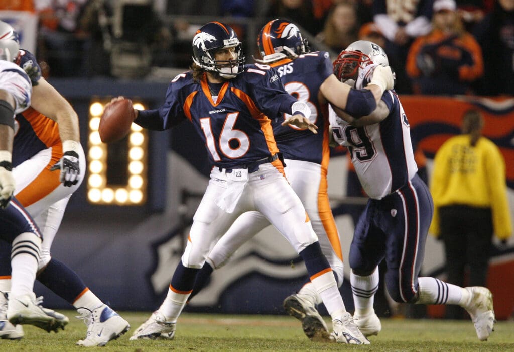 Jan  14, 2006; Denver, CO, USA; Denver Broncos quarterback (16) Jake Plummer throws in the pocket against New England Patriots in the third quarter during AFC Divisional Playoff game at Invesco Field at Mile High. The Broncos beat the Patriots 27-13. Mandatory Credit: Photo By Matthew Emmons- USA TODAY Sports Copyright © 2005 Matthew Emmons
