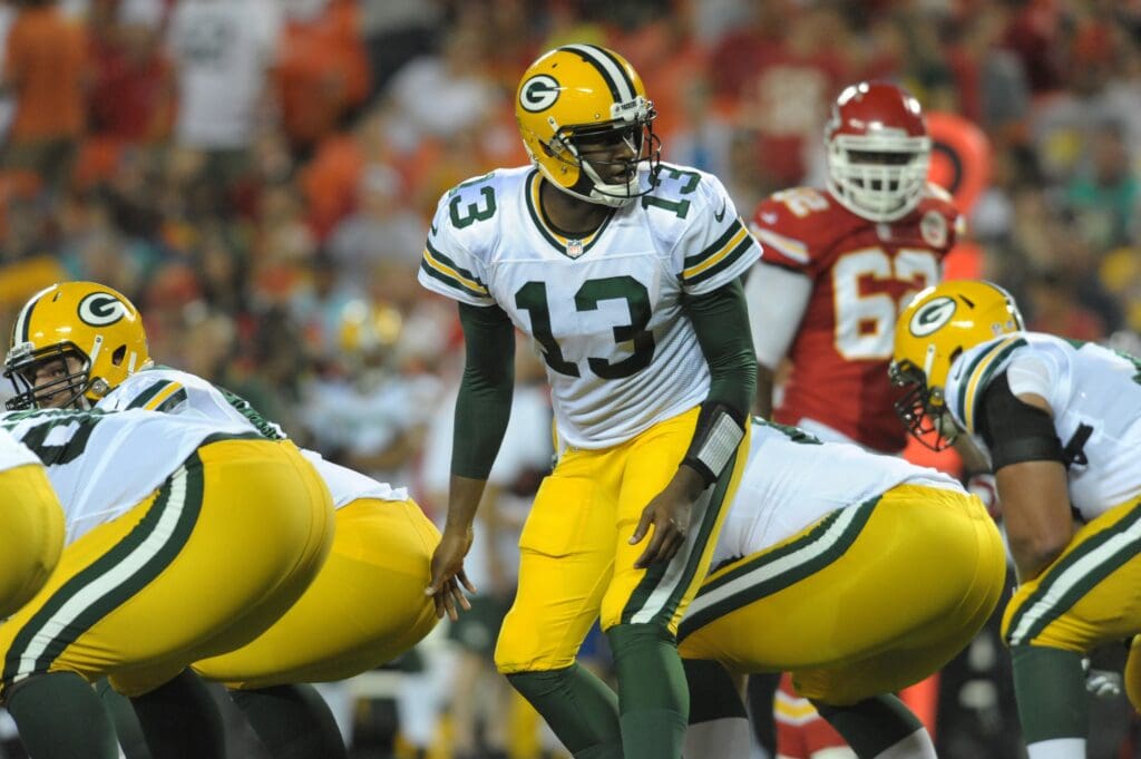 Aug 29, 2013; Kansas City, MO, USA; Green Bay Packers quarterback Vince Young (13) goes under center during the first half of the game against the Kansas City Chiefs at Arrowhead Stadium. Mandatory Credit: Denny Medley-USA TODAY Sports