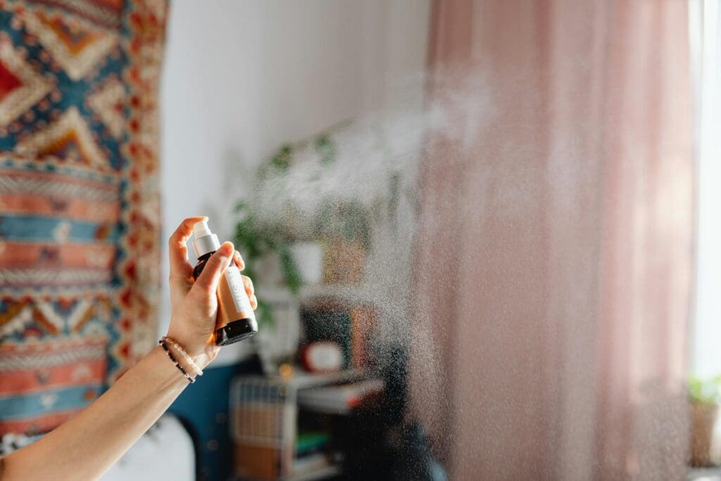 woman using room spray